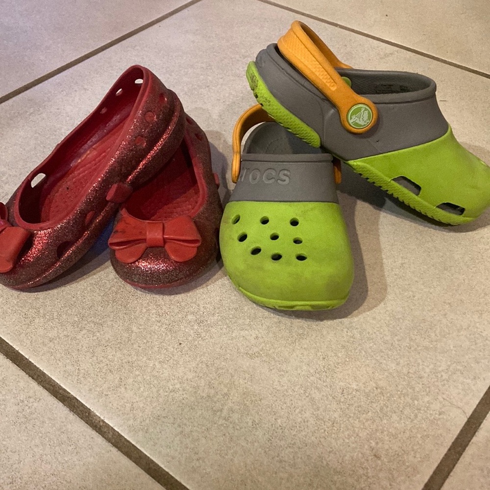Two pairs of cute kids crocs - size 7 (red) and 10 (green)